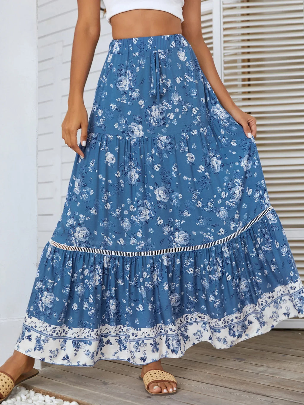 Floral tiered maxi skirt side view showing flowing A-line silhouette