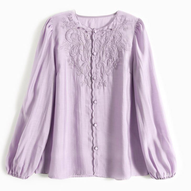 A light purple long-sleeve blouse with intricate floral embroidery on the chest and a button-up front, displayed against a plain white background.