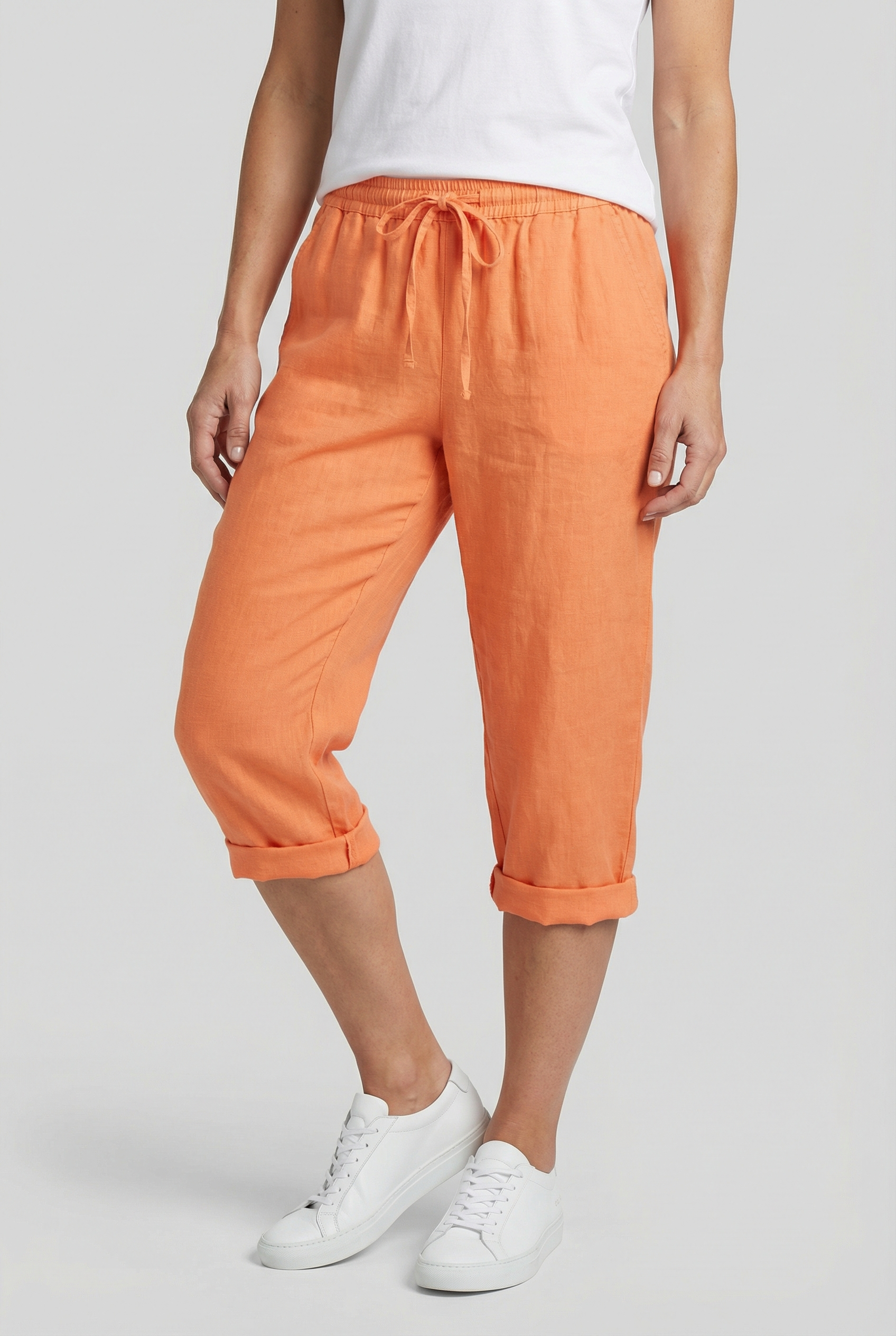 Linen capri trousers with elasticated waist in Orange, front view